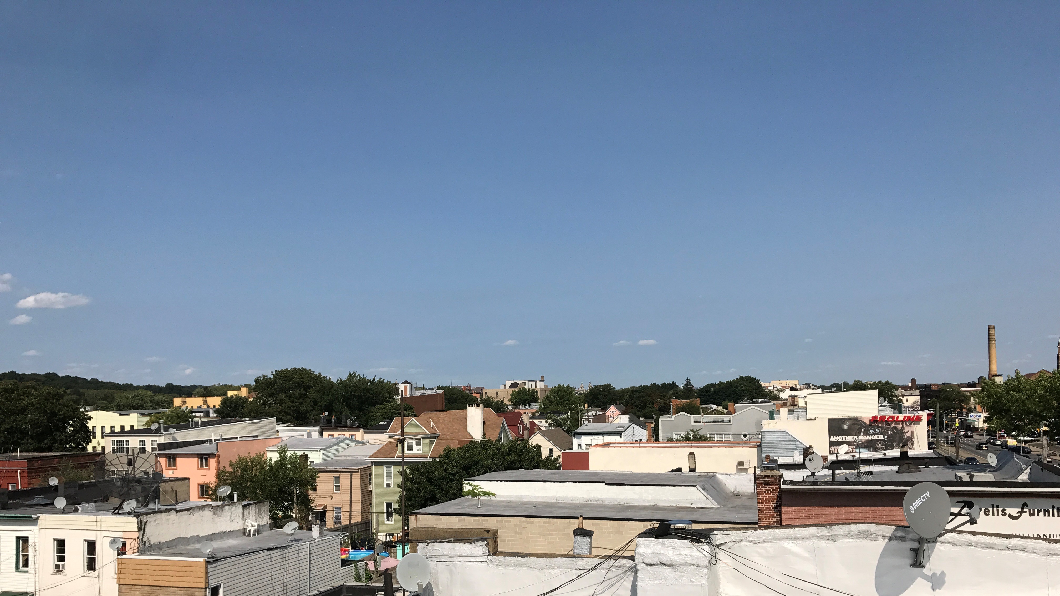 Wide photo of rooftops taken from a rooftop